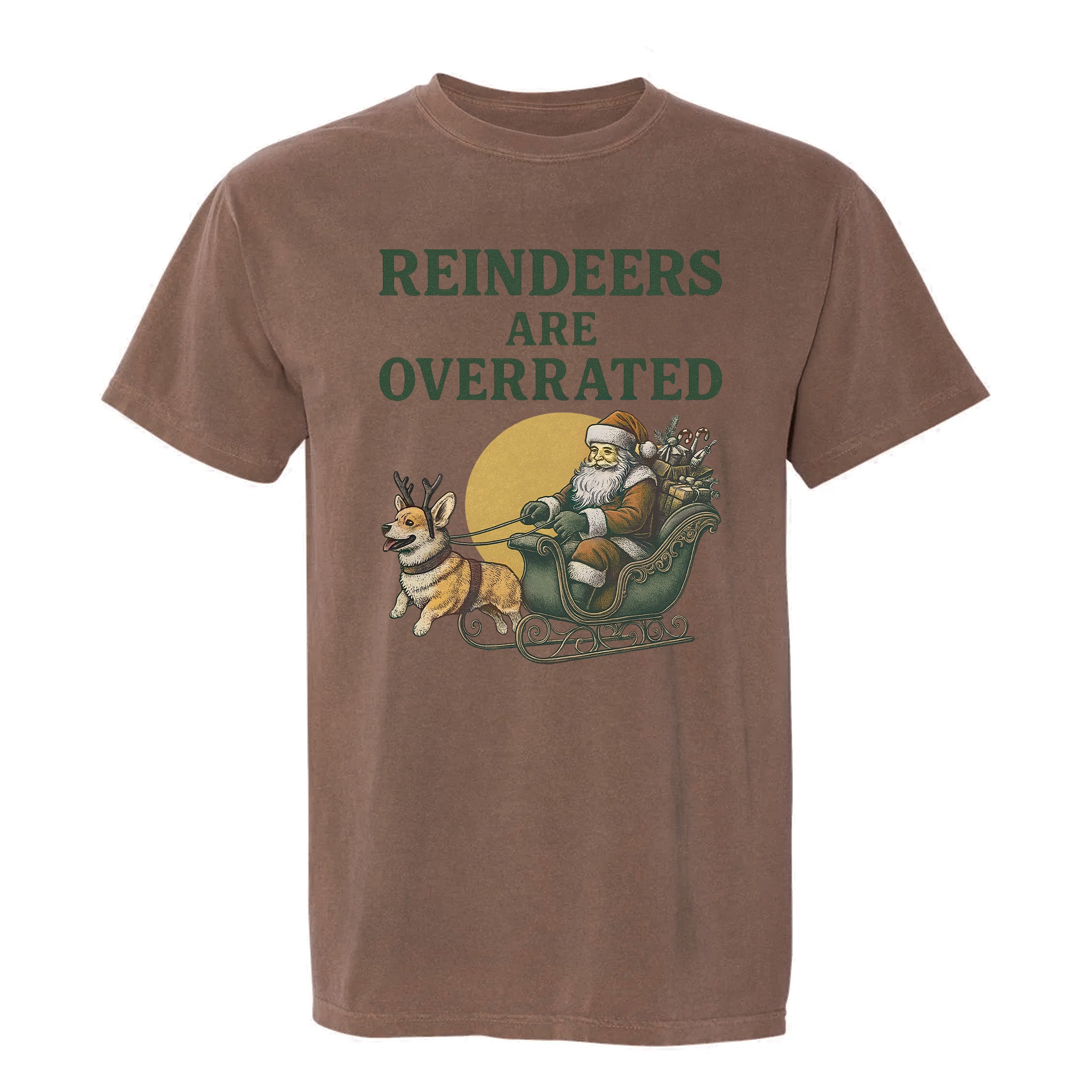 Brown Christmas graphic t-shirt featuring a playful design of Santa’s sleigh pulled by a corgi dog, captioned 'Reindeers Are Overrated'.