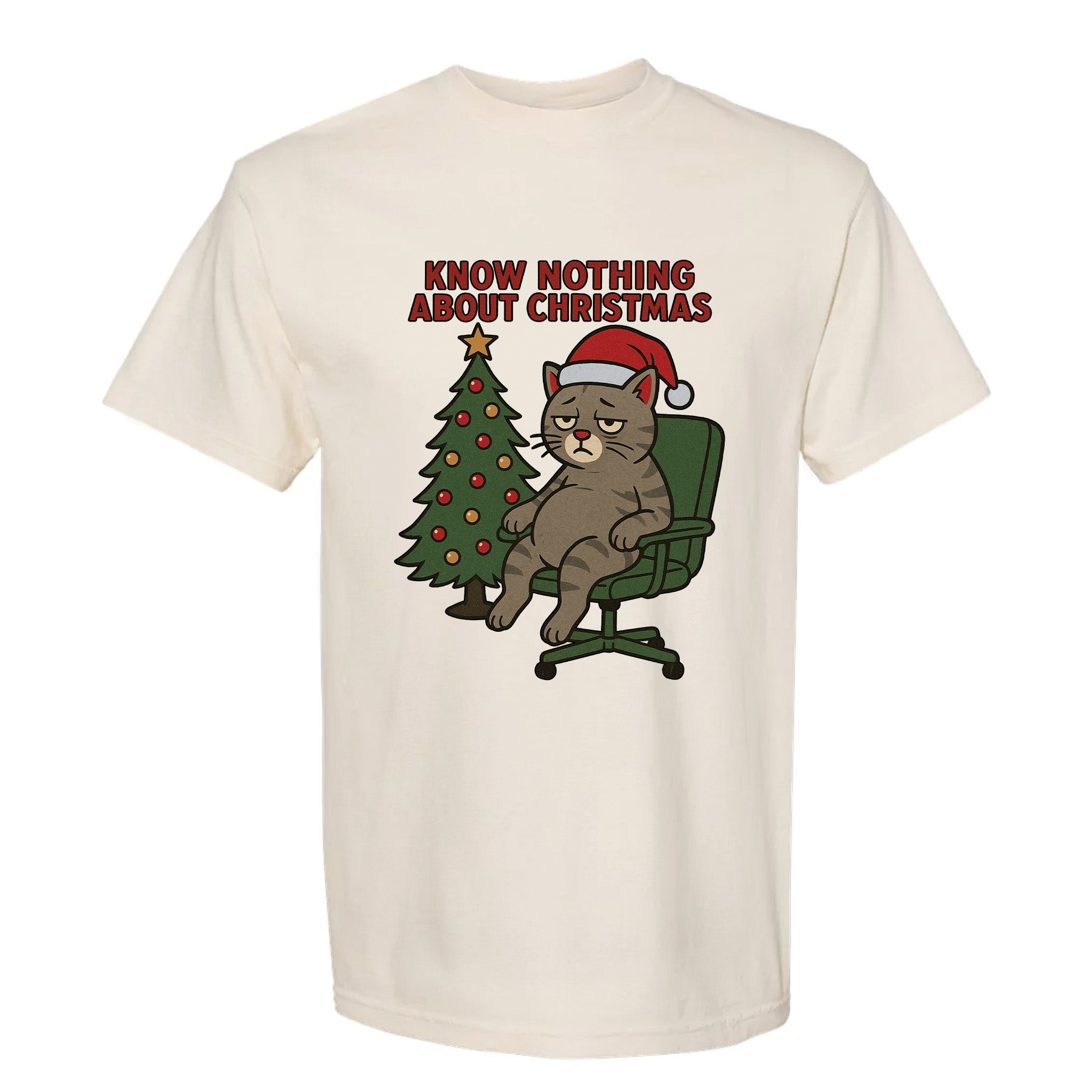 Beige Christmas graphic t-shirt with a cat sitting on a Christmas tree and text ‘Know Nothing About Christmas’.