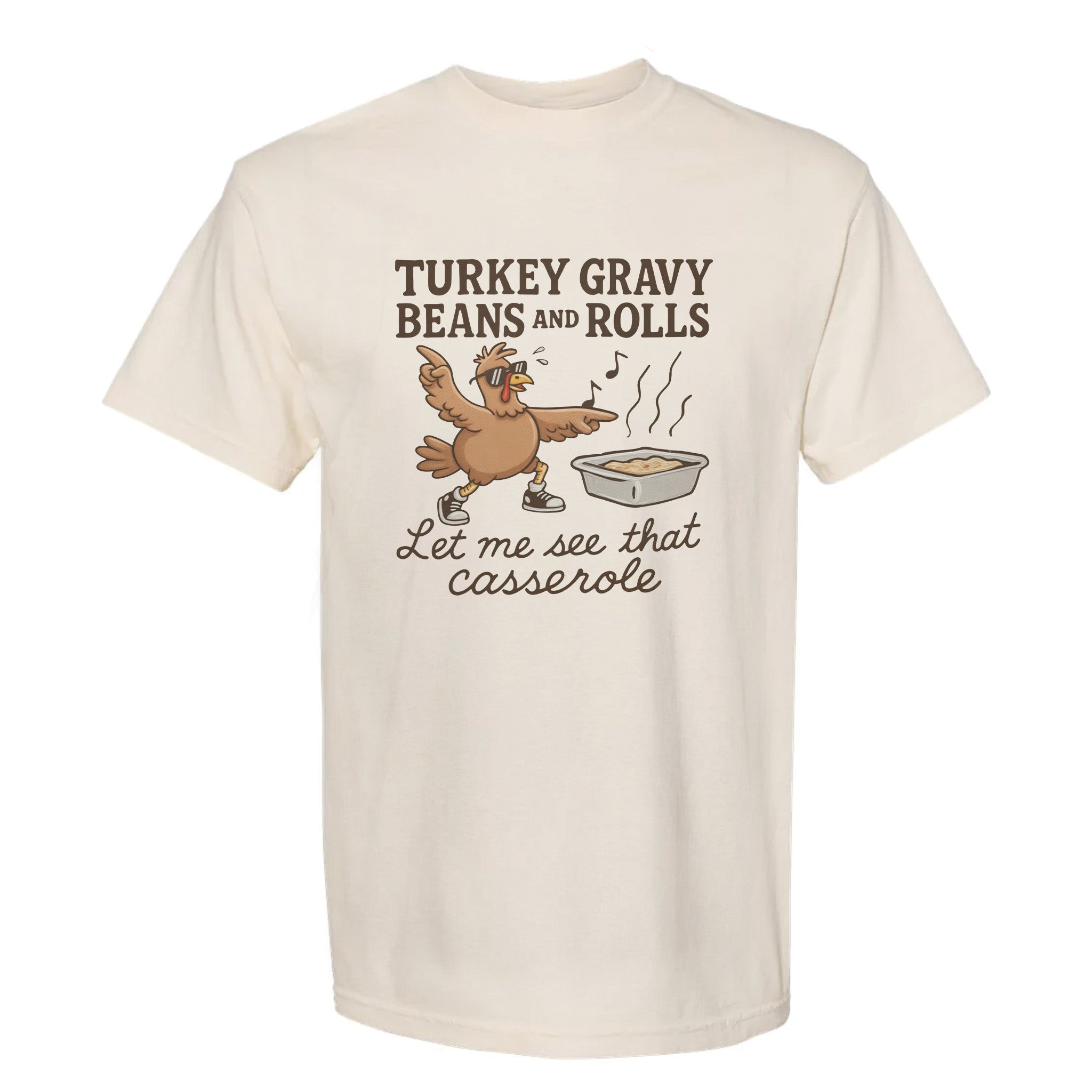 Beige Thanksgiving graphic t-shirt with a cartoon turkey and text 'Turkey Gravy Beans And Rolls, Let Me See That Casserole'.