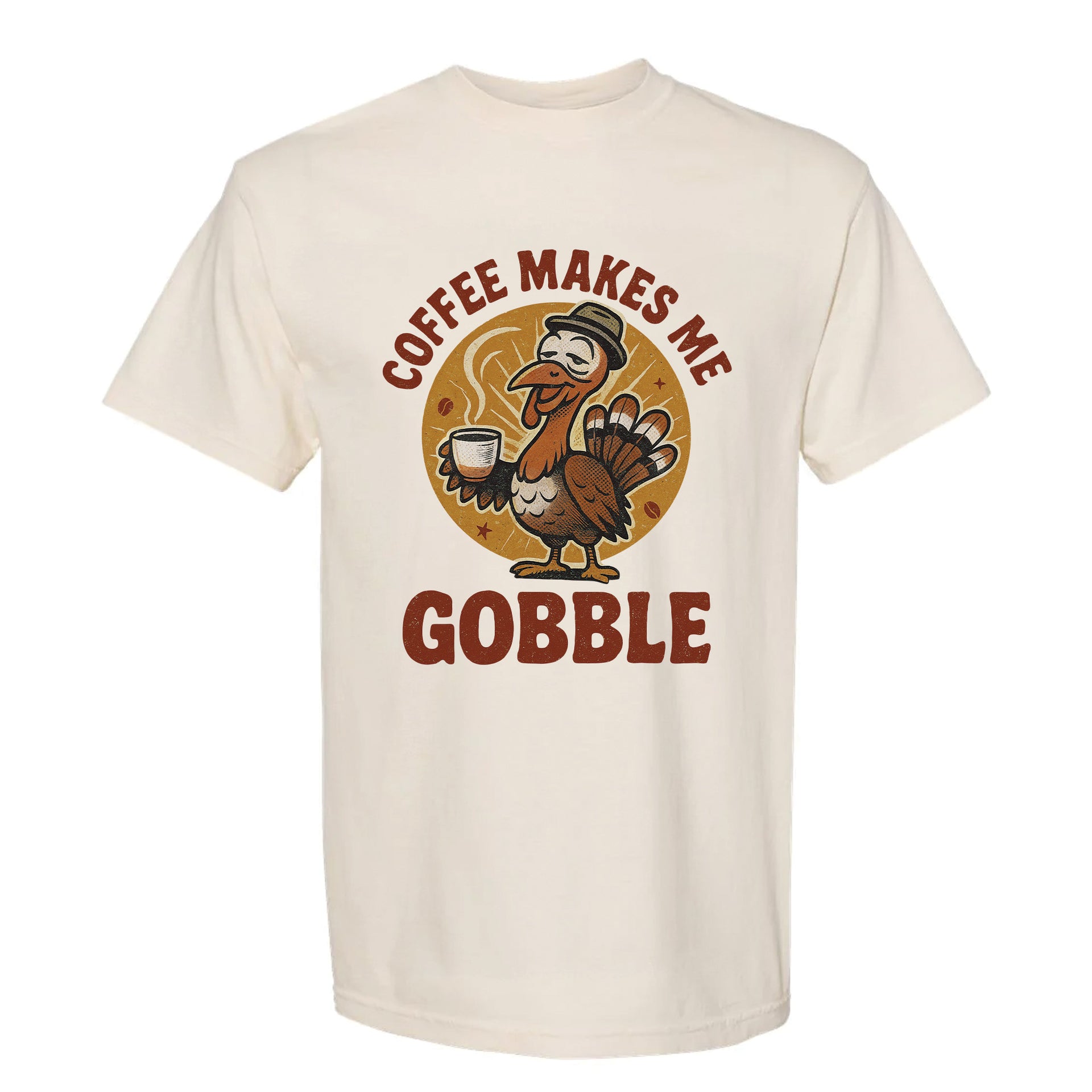 Beige Thanksgiving graphic t-shirt with a turkey graphic and text 'Coffee Makes Me Gobble'.