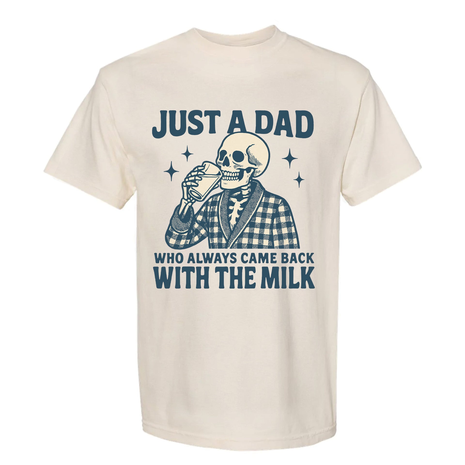 Beige funny graphic t-shirt showing a retro skeleton in a plaid robe drinking milk with bold text: “JUST A DAD WHO ALWAYS CAME BACK WITH THE MILK.”