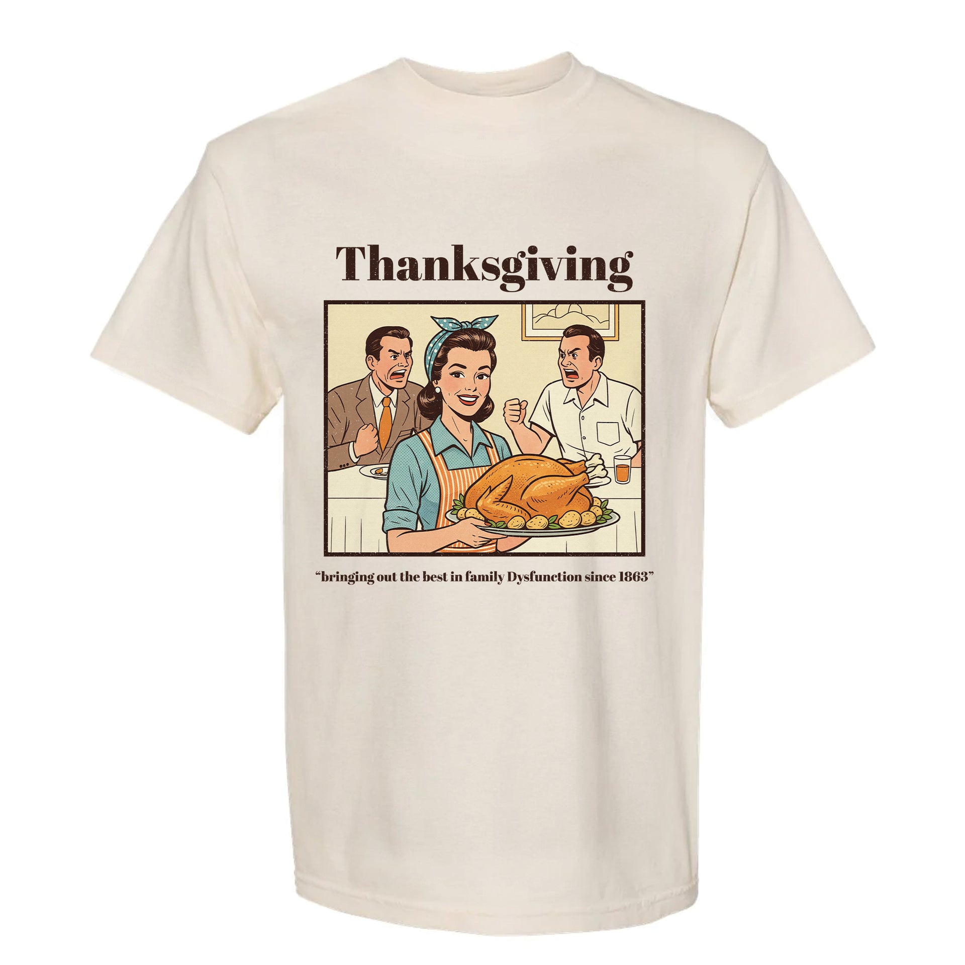 Beige Thanksgiving graphic t-shirt with a graphic of a family around a Thanksgiving dinner and text.